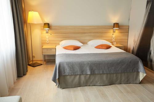 Łóżko lub łóżka w pokoju w obiekcie Scandic Wroclaw