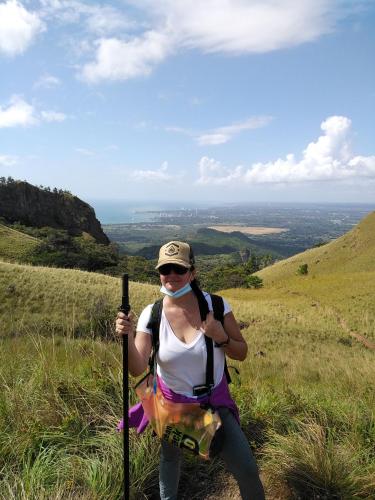 a woman standing on a hill with a mask on at The Blue House Panama in Chame