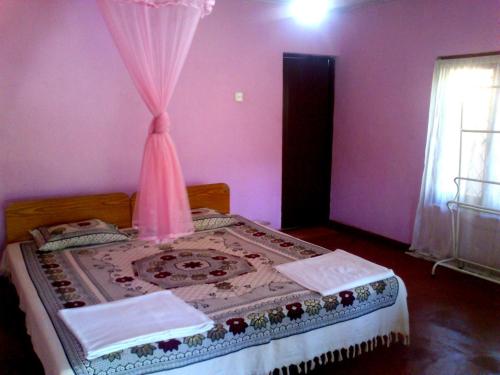 Cama o camas de una habitación en Haniffas Holiday Inn