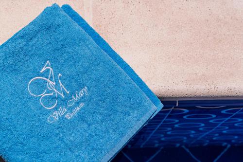 a blue book sitting on top of a floor at Villa Mary Suites in Positano