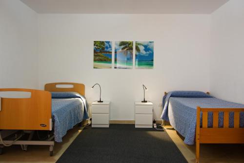 A bed or beds in a room at La Casita, a dos pasos de la playa