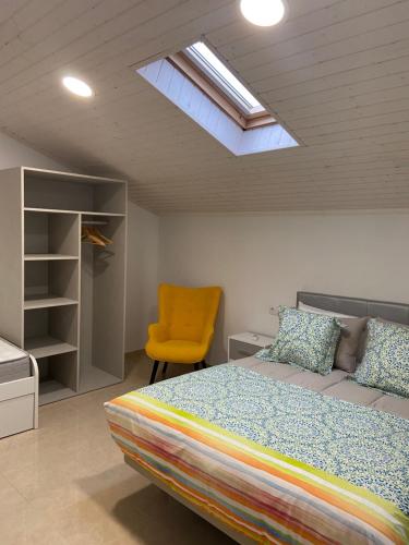 Katil atau katil-katil dalam bilik di Os Arcos - Apartamentos Turísticos