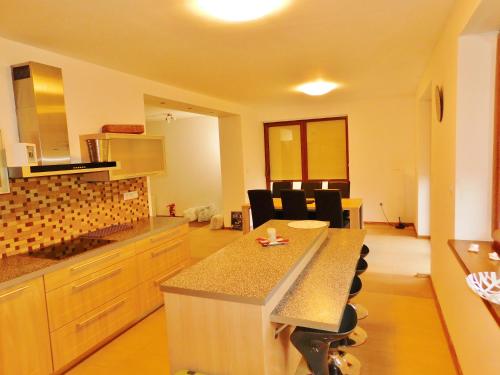 a large kitchen with a island in a room at Chalupa Staré Buky in Staré Buky