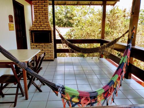 a hammock on the porch of a house at Pousada do Pescador in Florianópolis