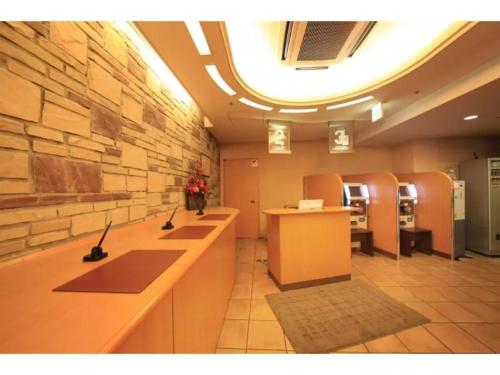 a bathroom with a row of sinks in a room at R&B Hotel Shin Yokohama Ekimae - Vacation STAY 14695v in Yokohama