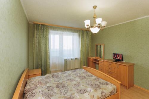 Apartment in the Center tesisinde bir odada yatak veya yataklar