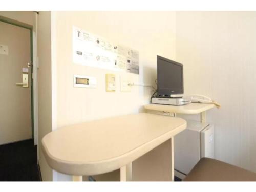 a white desk with a computer on top of it at R&B Hotel Sendai Hirosedori Ekimae - Vacation STAY 15197v in Sendai
