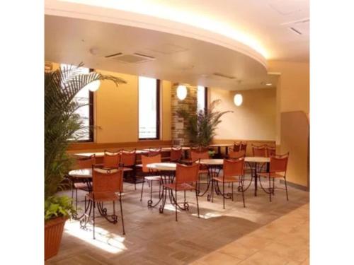 a restaurant with tables and chairs in a room at R&B Hotel Sendai Hirosedori Ekimae - Vacation STAY 15179v in Sendai
