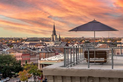a umbrella sitting on top of a building with a city at ONE11 Hotel in New Orleans