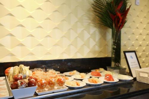 a buffet with many different types of food on display at Transamerica Prestige Recife - Boa Viagem in Recife