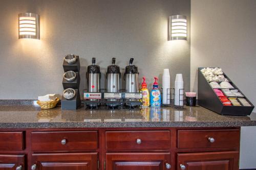 a counter with a coffee maker on a counter top at Red Roof Inn Batavia in Batavia