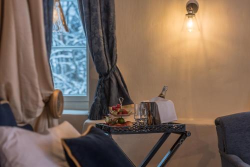 a table with a tea kettle and fruit on it at Kernu Manor Hotel & SPA in Kernu