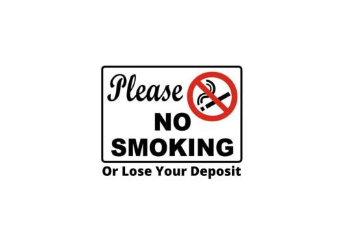 a sign that reads leave no smoking or lose your deposit at Vacation Pool House in the Serene Wilderness - Robert E Lee in Conroe