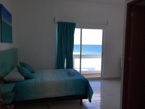 Ένα ή περισσότερα κρεβάτια σε δωμάτιο στο Habitación Amanecer Turquesa #5