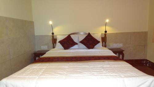 Cama o camas de una habitación en Sunarta House Homestay