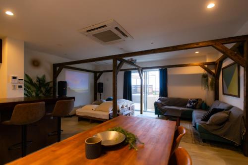 a living room with a table and a couch at Cinema Villa in Shushi