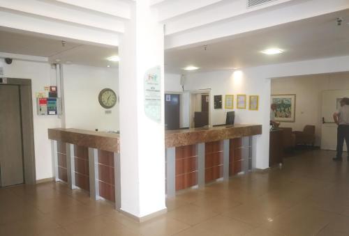 a lobby of a hospital with a counter in a room at Astoria Galilee Hotel in Tiberias