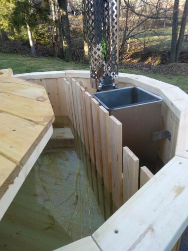 a wooden deck with a sink in a pool of water at U ponocného pod Ondřejníkem in Frýdlant nad Ostravicí
