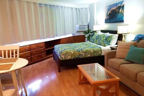 a small living room with a couch at Waikiki Marina Studio, Ocean view, Free Parking & Wifi in Honolulu