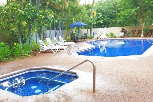 a large swimming pool with aicrobialicrobialicrobialicrobial at Waikiki Marina Studio, Ocean view, Free Parking & Wifi in Honolulu