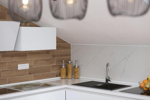 a kitchen with a sink and a counter top at Apartment Lungo Mare, Centar in Makarska