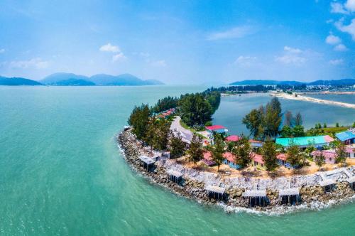 an island in the water with a resort at WORLD KIDS FANTASY in Lumut