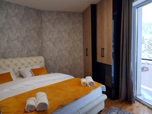 Ένα ή περισσότερα κρεβάτια σε δωμάτιο στο APARTHOTEL CENTRALA Apartman 10