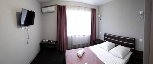Кровать или кровати в номере Готель Тростянець