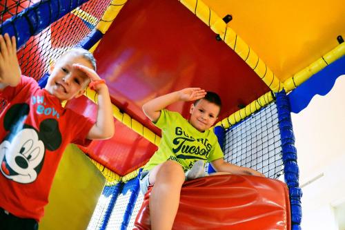 two young children playing on a trampoline at Kolping Holiday Resort in Hévíz