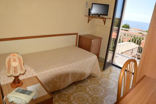 Кровать или кровати в номере Hotel Virgilio
