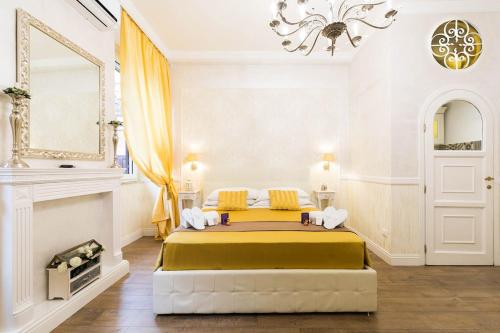 a bedroom with a large bed in a white room at Sweet Life Trevi Roma in Rome