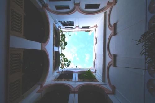 a view from the inside of a building with a window at Kanhaia Haveli in Pushkar
