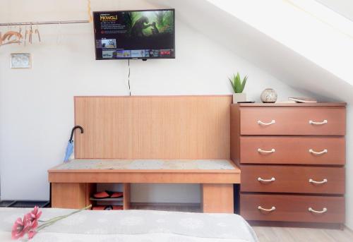 a desk and a dresser in a room at Apartmán Castle view in Český Krumlov