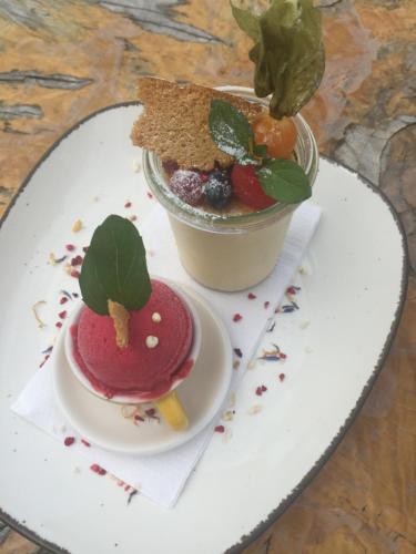 a plate with a dessert on a table at Gasthof Wiesenhof in Strobl