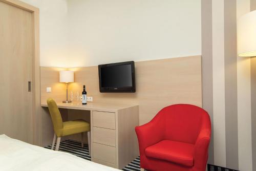 TV a/nebo společenská místnost v ubytování Kolping Hotel Spa & Family Resort