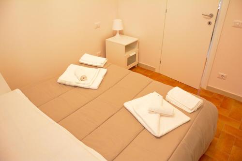 Кровать или кровати в номере La Casa di LEO - Apartments