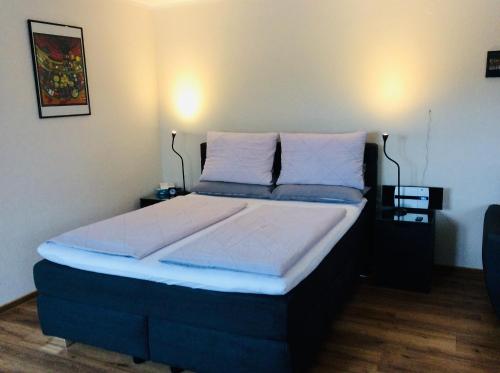 Кровать или кровати в номере Fernblick