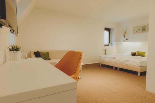 Posteľ alebo postele v izbe v ubytovaní Penzion Nový Rybník