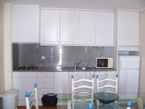 Dapur atau dapur kecil di Apartamentos Varandas da Rocha