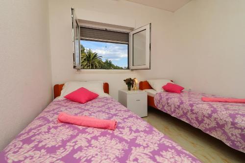מיטה או מיטות בחדר ב-Apartments Belin Mljet