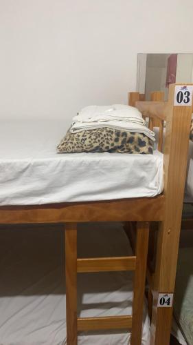 a bunk bed with a pillow on top of it at Pousada Beira Mar in Recife