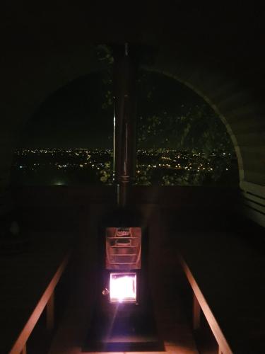 a room with a view of a city at night at Chalet de la Sablière in Amougies
