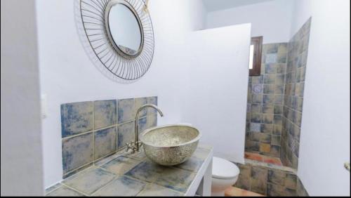 a bathroom with a sink and a mirror at El Puente in Ronda