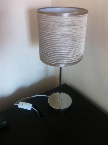 a lamp on top of a table with aperature at Bridge Hotel Brandon in Brandon