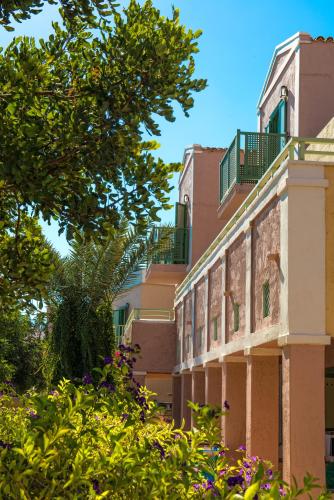 a building with balconies on the side of it at Silva Beach Hotel in Hersonissos