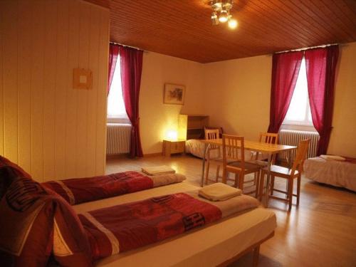 Postel nebo postele na pokoji v ubytování Hôtel Garni Villa Carmen