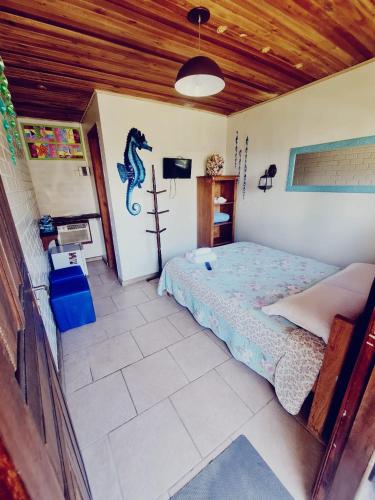 a bedroom with a bed in a room at Hotel Praia Do Rosa in Praia do Rosa