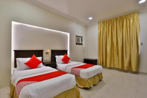 En eller flere senge i et værelse på نسمات الشرق للشقق المخدومه