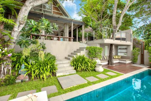 a villa with a swimming pool and a house at The Headland Villa 2, Samui in Koh Samui