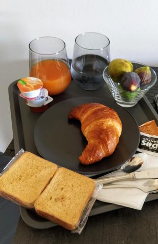 a table with a plate of bread and toast at B&B FRONTEMARE San Salvo Marina CH in San Salvo